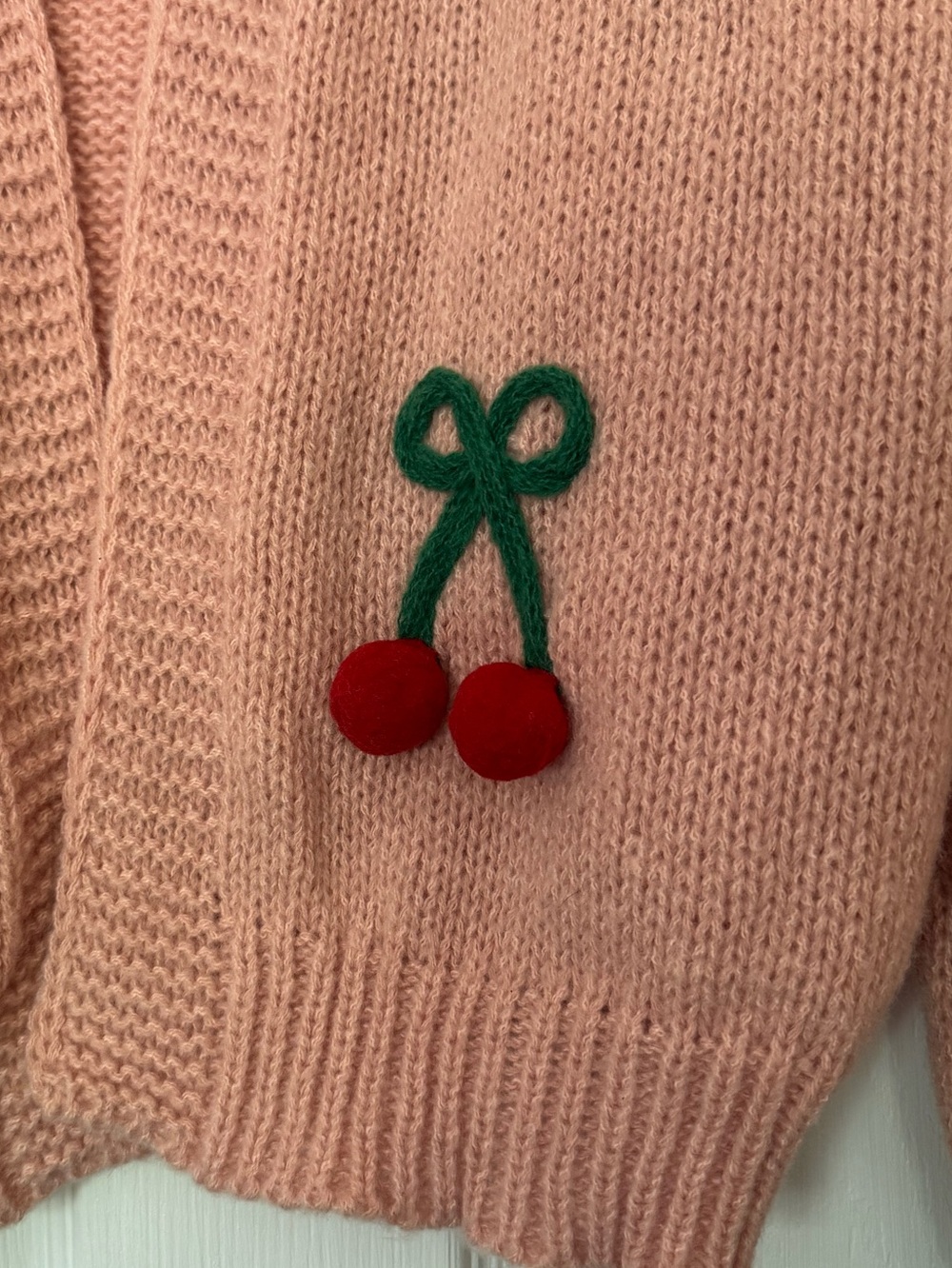 Pink Luna Ivy cardigan featuring prominent green and red 3D cherry appliqués. - Picture 3 of 6